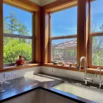 Bright art-filled home, fruit trees, valley view