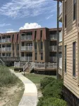 Enjoy an oceanfront getaway with beautiful beach steps from your door. - balcony