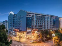 Vienna Hotel（Maitre Lake spring Township hot spring shop） Hotels in Huquan Ecological Park/Honghe Nativeland