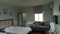 Xichang Shunda Business Hotel - إقامة ريفية