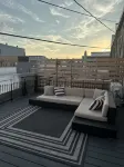 Stylish & Modern 2-Bdrm Apt in Downtown Warsaw featuring an urban rooftop deck.