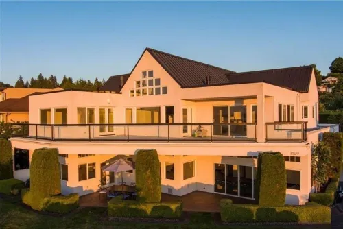 Relaxing in an Entire 5,400sf Beach View Home With Indoor Heated Swimming Pool.