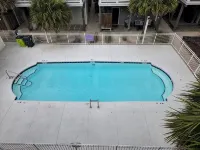 Coastal Comfort: 4-bedroom house with pool and sound access, 3 min walk to beach