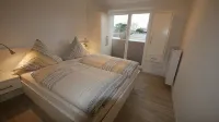The popular Nordbadestrand beach is just 5 minutes away by bike. - Apartments