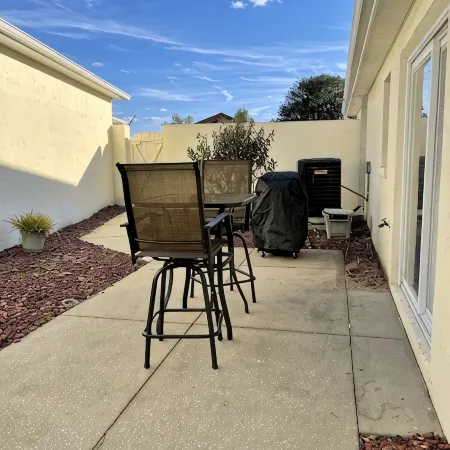 Courtyard Villa with gas golf cart located between two Town Squares!