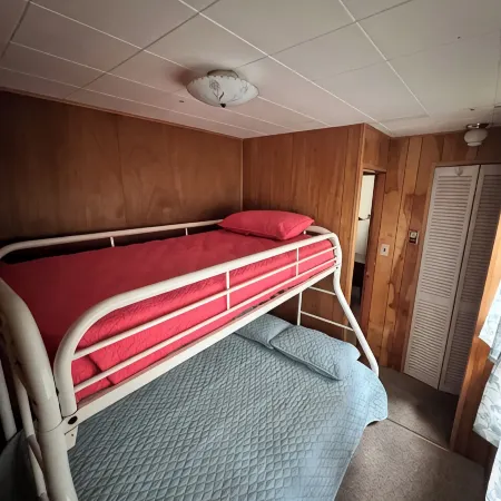 Charming 2-bedroom cabin sits on 2.5 acres on Hubbard Lake.