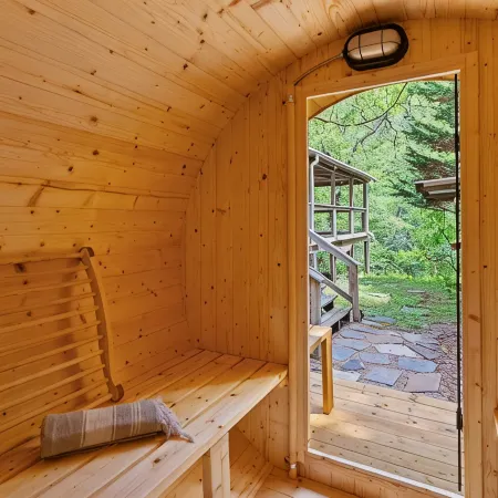 Cozy Creekside Cabin w/ Wraparound Covered Deck and Barrel Sauna