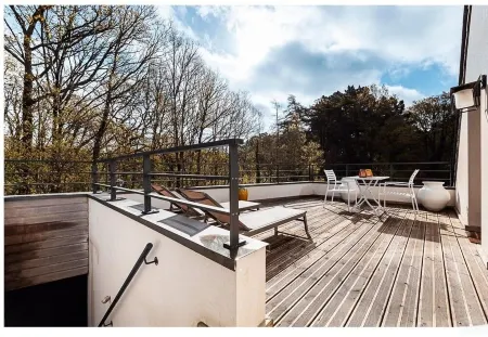 In a green setting close to the ocean