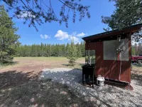 Retreat to our cozy cabin nestled in a private hideaway.Solar lights & shower