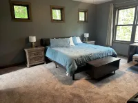 BEAUTIFUL lake front home with a private beach, dock and large yard