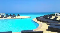 Steps from beach and infinity pool, Golf Cart Optional