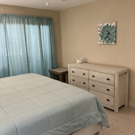 The Harvey Nicole: Modern Caribbean Ocean Front Condo Grand Cayman.
