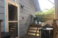 Covered parking/3 bedrooms, sitting room, restroom w/laundry, full kitchen, deck