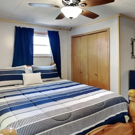 Spacious and cozy home with gas fireplace, boat dock, and lake views