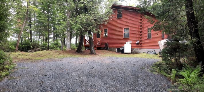 Escape to Howie's Camp: Unwind and Recharge at This Lakefront Log Cabin Hotels in Piscataquis County