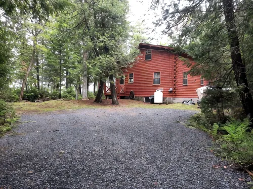 Escape to Howie's Camp: Unwind and Recharge at This Lakefront Log Cabin