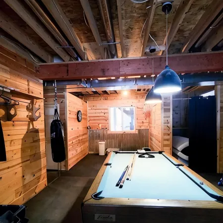 Six bedroom home with a hot tub, pool and an outdoor bar on a two acre lot.