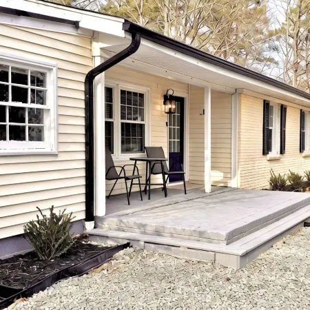 Updated 4-bedroom house with relaxing sunroom; minutes from downtown Raleigh.