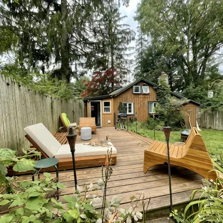 Cozy cabin with deck and fireplace steps from White Pond Lake. Dog friendly.