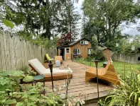Cozy cabin with deck and fireplace steps from White Pond Lake. Dog friendly.