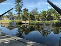 Offering Breathtaking Views of the Sun Setting over the Water. - Homestays