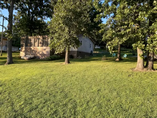 Relax at Grandma’s house with a screened in porch overlooking a private lake!