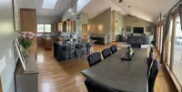 Fully custom modern four bedroom home on 13 acres with a stocked pond.