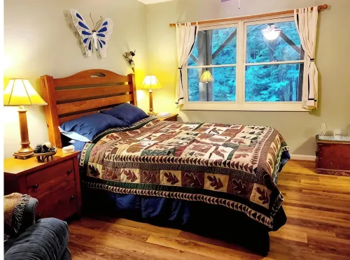Spacious suite surrounded by nature with living room, fireplace, porch, fire pit