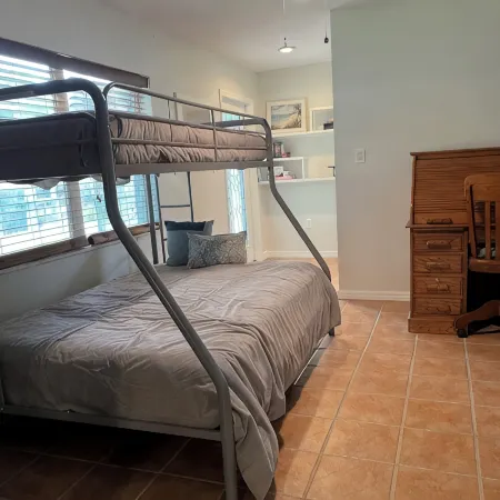 Spacious home directly on Lake Grassy canal. Boat house, hot tub & pool table