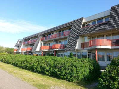 Ameland - apartment with balcony to the south side with a view of meadows and the village of Buren