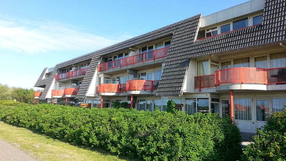 Ameland - apartment with balcony to the south side with a view of meadows and the village of Buren