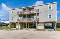 Luxury Beachfront Condo with Covered Deck Steps From Beach & Golf Cart Rental - 4-Star