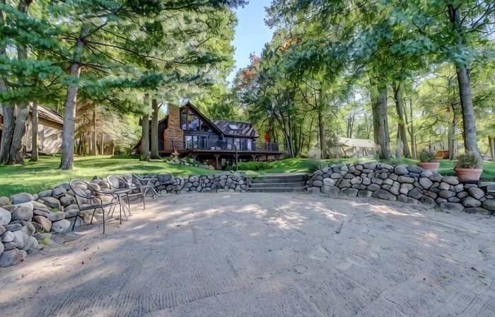 Whitefish Chain Lake Home with Beach + Sauna + King Beds + Kayaks +Paddle Boards