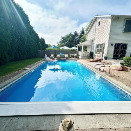Spacious 5Bdrm Home- Saltwater Pool, WiFi, AC, Private Beach Parking Pass