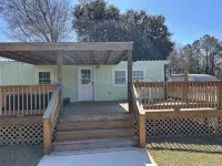 Charming 3-bedroom bungalow in Sneads Ferry with boat dock and gazebo access - Wi-Fi