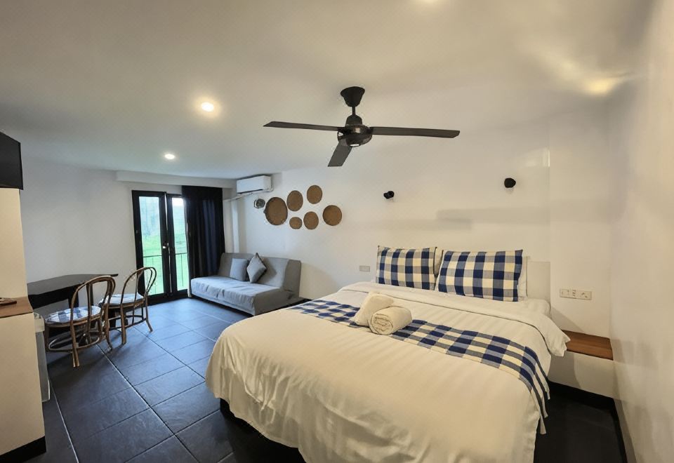 Taman Unique Hotel의 아늑한 객실 내부 인테리어 이미지