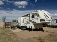 Cozy RV tucked back in a quiet property with plenty of room to relax