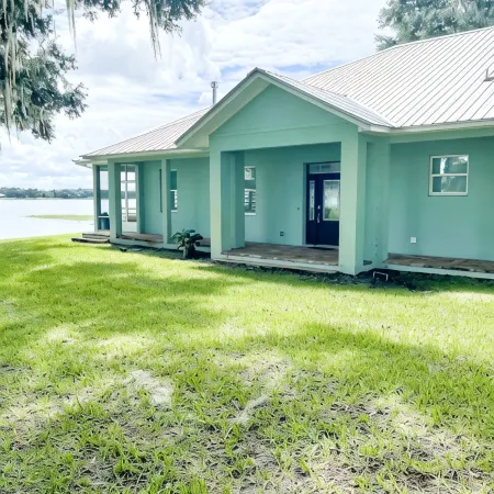 Beautiful home with white sand beach on stunning Crooked Lake
