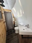 Cozy lakeside glamping dome with fireplace, AC and full bath.