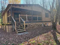 Riverside cabin in the woods