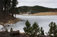 A beautiful mountain lake setting located in the 'Heart of the Black Hills'
