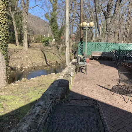 Brookside Cottage is a beautiful open concept doll house stay for two.