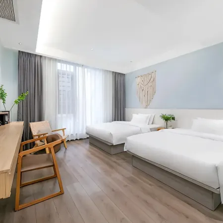Muqi Jiushe Design B&B (Longyan Railway Station Minxi Trading City)