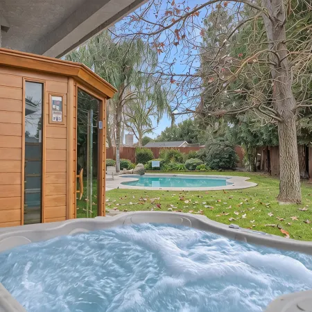 Home oasis with sauna, jacuzzi, pool & heated gazebo!