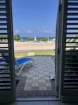 The Harvey Nicole: Modern Caribbean Ocean Front Condo Grand Cayman.