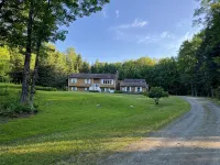 Spacious five-bedroom home off Back Lake with direct trail access on Spooner Rd