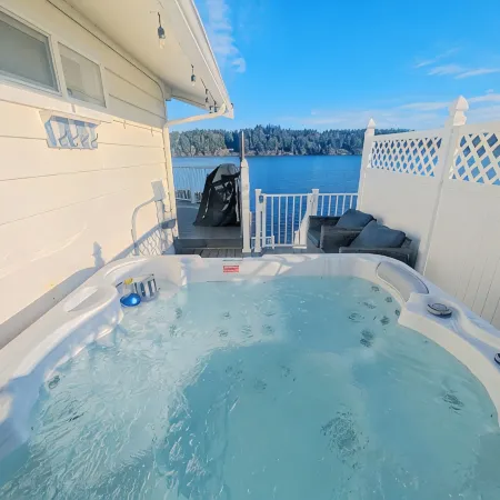 Waterfront Villa with Private Beach, Hot tub, EV & WFH