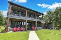 Richland Chambers Lakefront 2-story home with boat dock and pavilions.