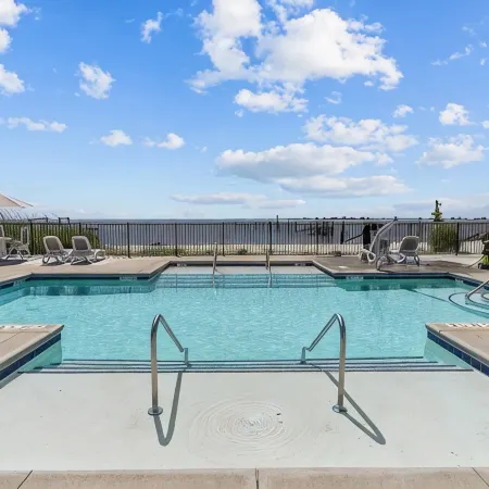No Cleaning Fee! Brand New Double Queen Studio Condo w/ Waterfront Pool + Beach