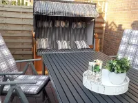 Holiday home in a quiet location in the center of Nordseebad Tossens Hotels in Tossens